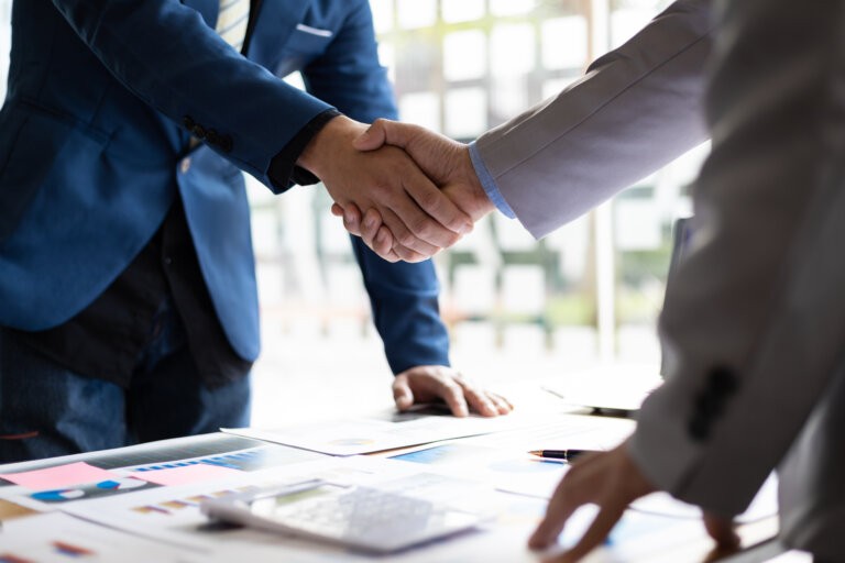 Business partner handshake after the meeting. Financial and investment cooperation. estate planning and probate sombathy law firm