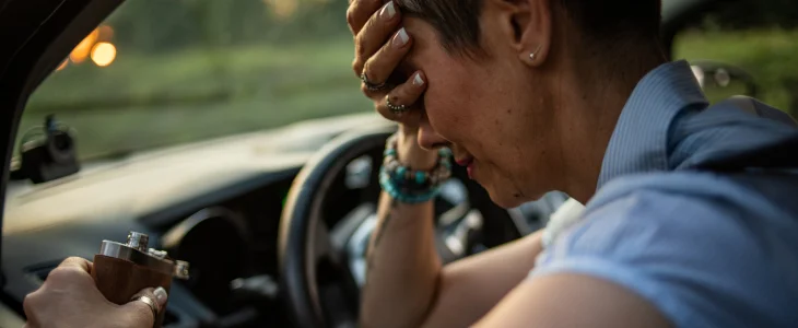 Woman drinking while driving