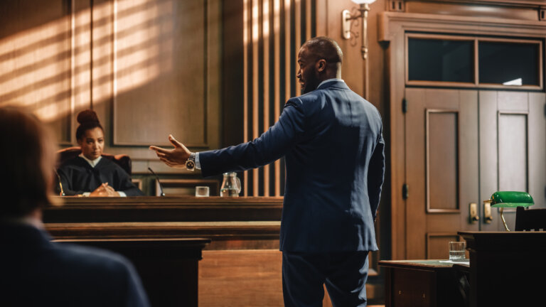 Portrait of Charismatic Male Public Defender Making Touching, Passionate Speech to Judge and Jury.