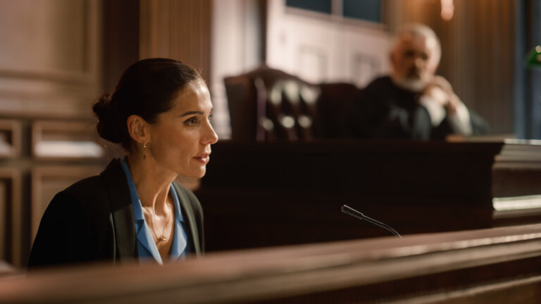 Portrait of Beautiful Female Victim Giving Heartfelt Testimony to Judge