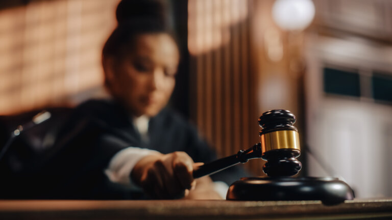 Honorable Female Judge Pronouncing Sentence, striking Gavel