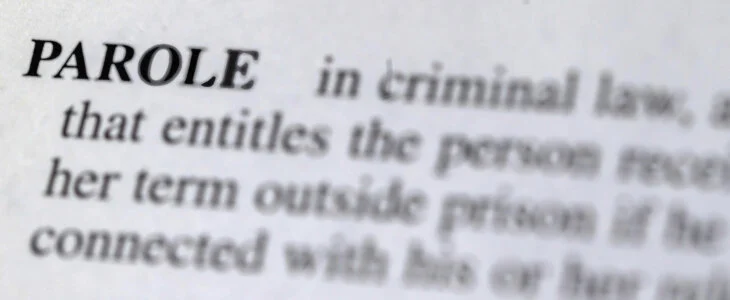 close up photo of the word parole in the dictionary